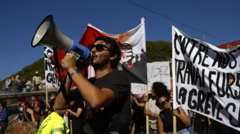 Countrywide Protests Break Out In Response to Spending Cuts